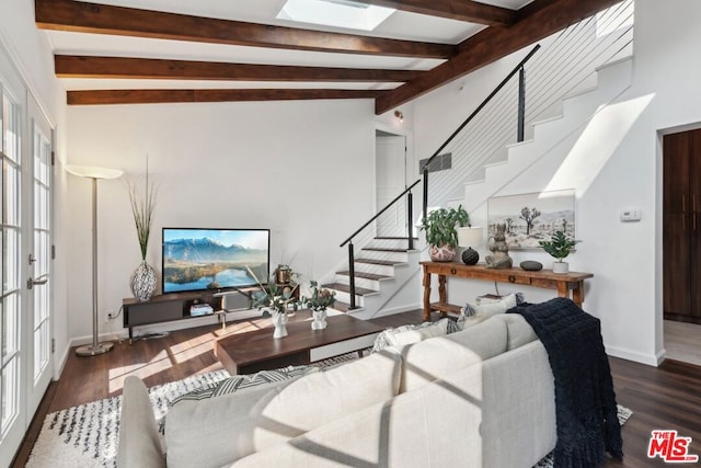 living room with french doors, dark wood-type flooring, and lofted ceiling with skylight