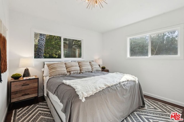 bedroom featuring dark wood-type flooring