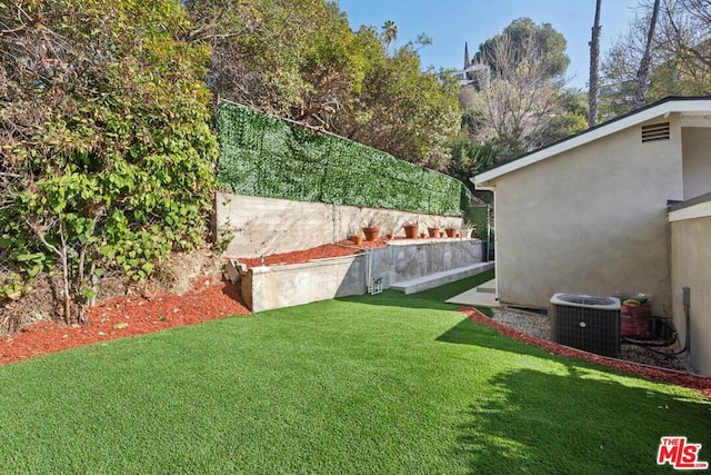 view of yard featuring central AC unit