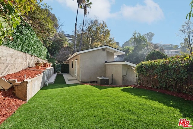 view of yard featuring central AC