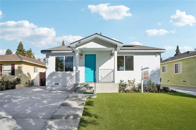 bungalow-style house with a front lawn