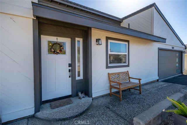 doorway to property featuring a garage