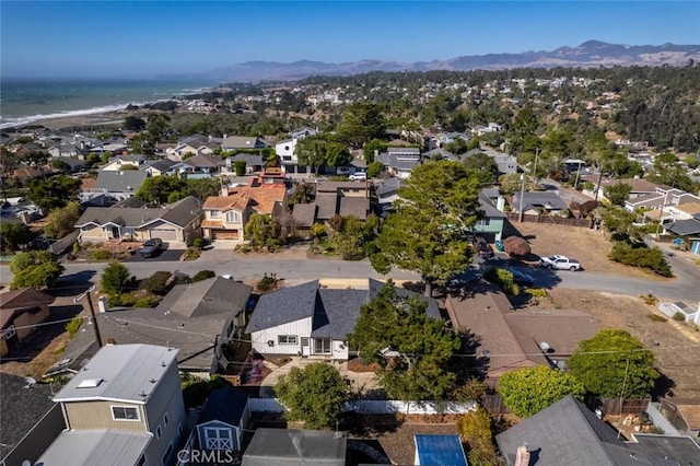 birds eye view of property featuring a water and mountain view