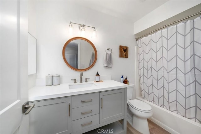 full bathroom with tile patterned flooring, shower / bath combination with curtain, vanity, and toilet