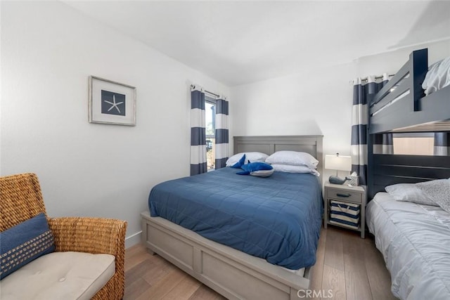 bedroom with wood-type flooring