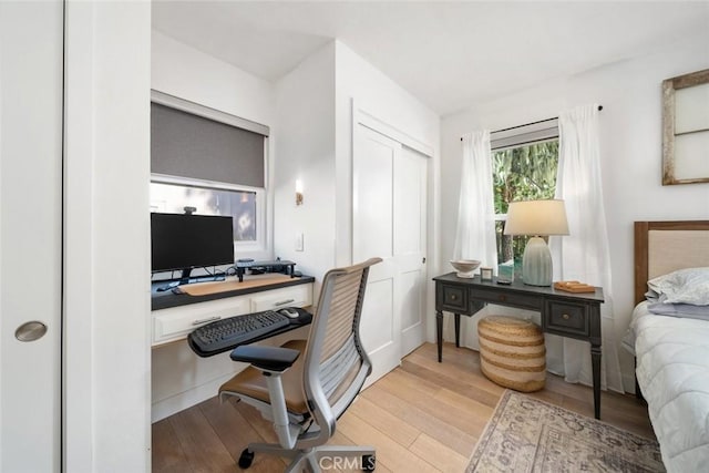 bedroom with light wood-type flooring