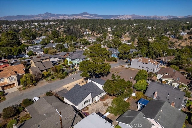 birds eye view of property with a mountain view