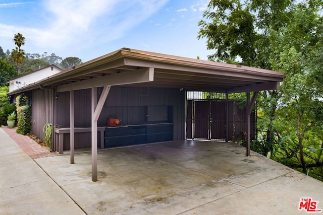 garage featuring a carport