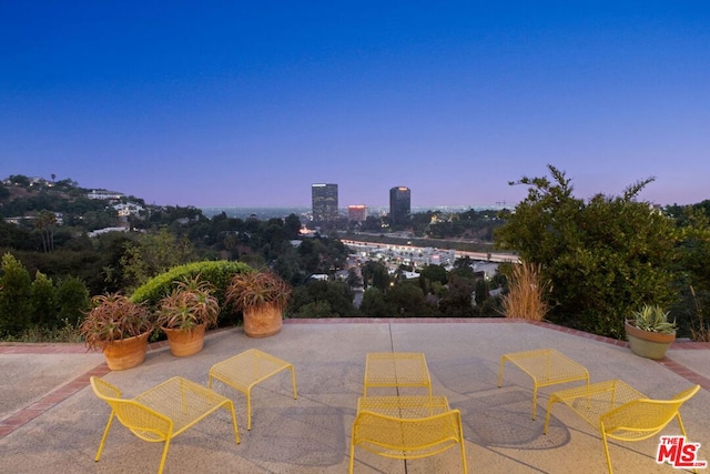 view of patio terrace at dusk