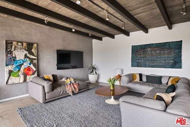 living room with beamed ceiling and track lighting