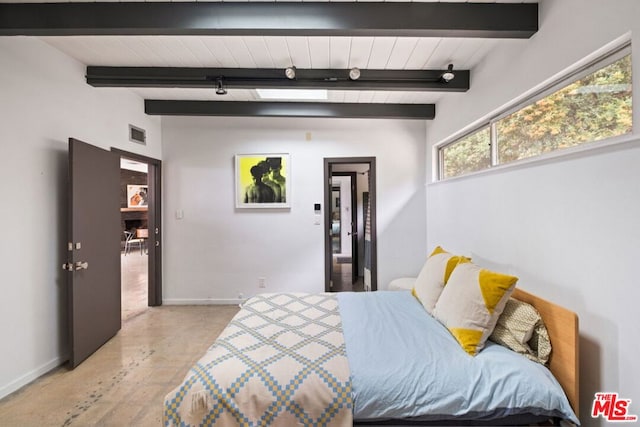 bedroom featuring beam ceiling