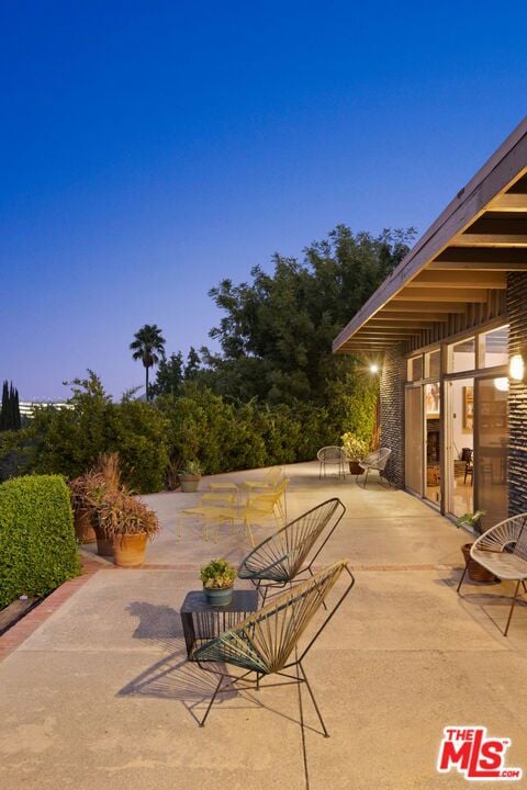 view of patio terrace at dusk