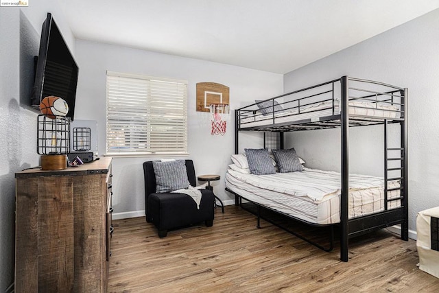 bedroom with hardwood / wood-style floors