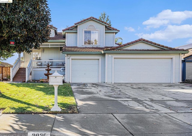 front of property with a front yard and a garage