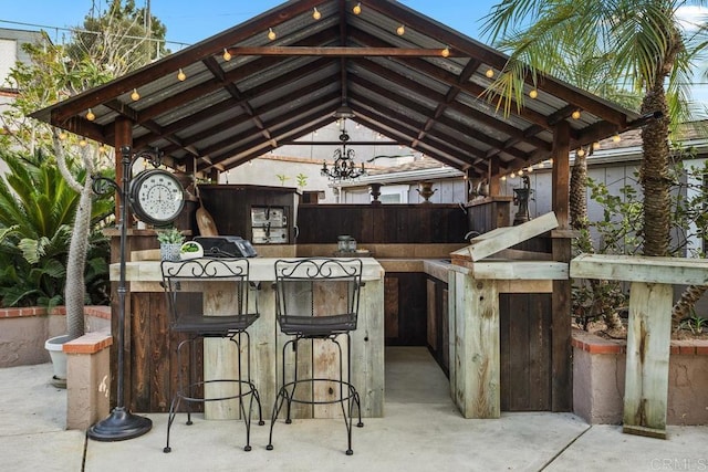 view of patio with a gazebo and a bar