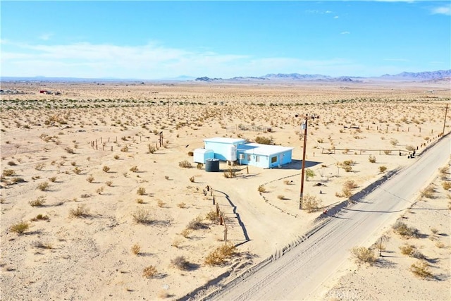 drone / aerial view featuring a mountain view