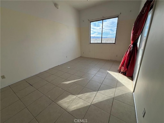 5830 Gopher Grove Rd Unit 29, Palms, CA 92277 - spare room with light tile patterned floors