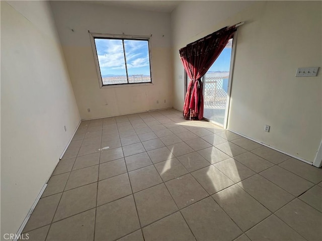 empty room with light tile patterned floors