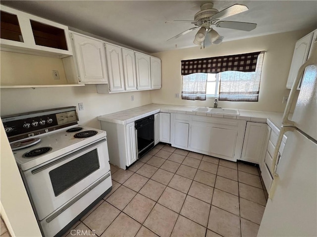 kitchen featuring white cabinetry, sink, tile countertops, white appliances, and light tile patterned floors