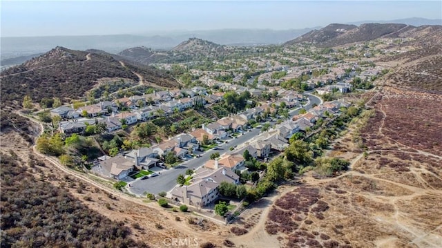 birds eye view of property featuring a mountain view