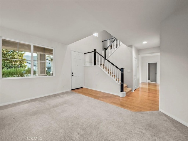 unfurnished living room featuring carpet flooring