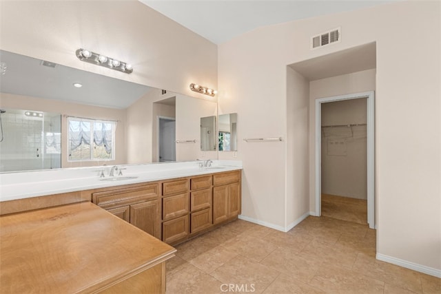 bathroom featuring vanity, tile patterned floors, and an enclosed shower