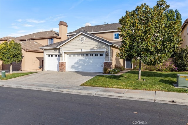 view of front of house with a garage and a front yard