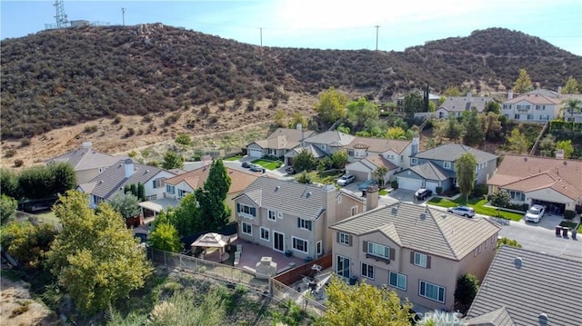 birds eye view of property with a mountain view