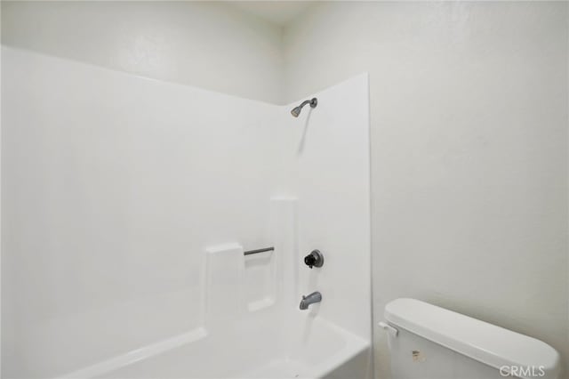 bathroom featuring toilet and shower / washtub combination