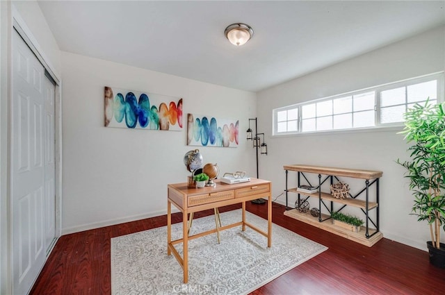 office with dark hardwood / wood-style flooring