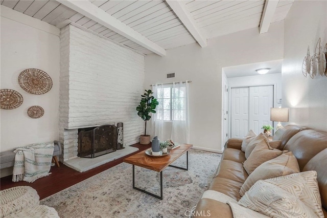 living room featuring wood ceiling, vaulted ceiling with beams, a fireplace, and hardwood / wood-style floors