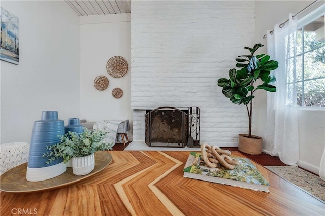 living room with a brick fireplace