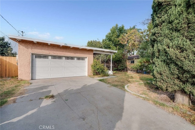 garage featuring a carport