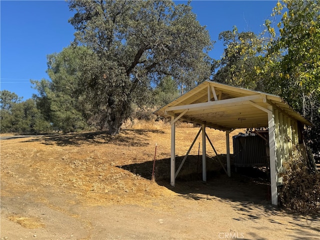 view of outbuilding featuring a carport