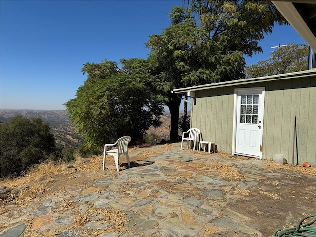 view of patio featuring a storage unit