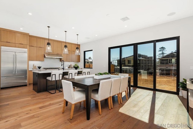 dining room featuring light wood-type flooring