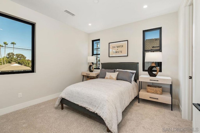 bedroom with light carpet