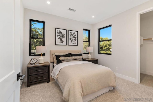 bedroom featuring light colored carpet