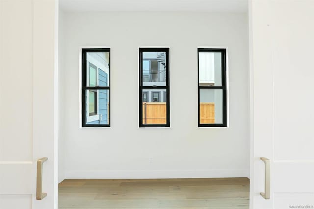 spare room featuring light hardwood / wood-style flooring