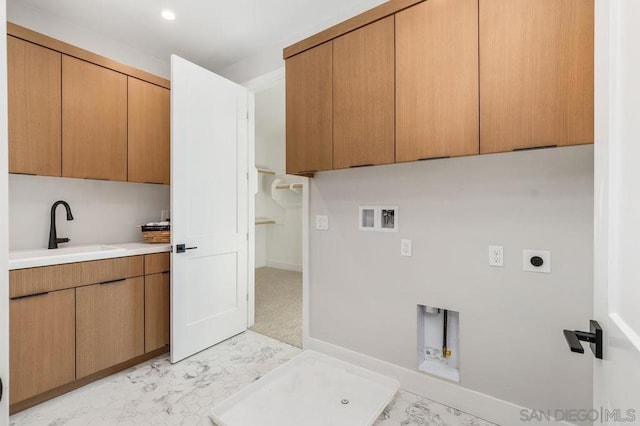 clothes washing area with washer hookup, cabinets, sink, and electric dryer hookup