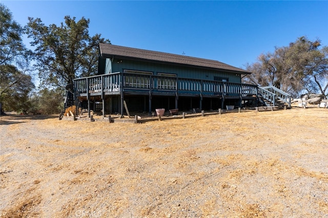 back of property featuring a wooden deck