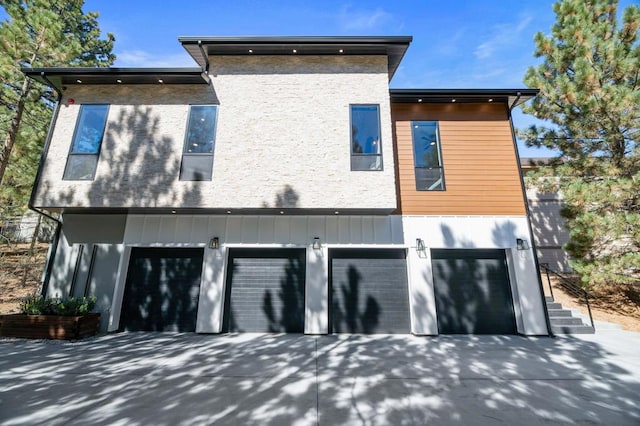 rear view of house with a garage