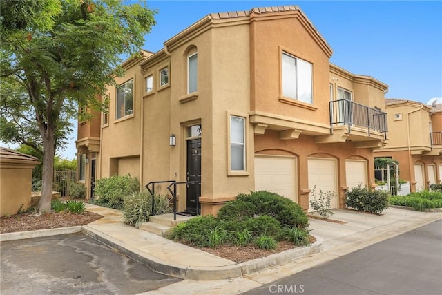 26961 Hillsborough Unit 56, Valencia, CA 91354 - view of property featuring an attached garage and driveway