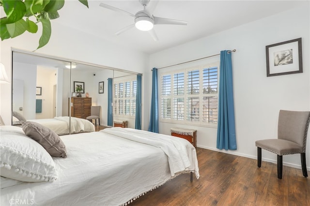 bedroom with dark wood-type flooring and ceiling fan