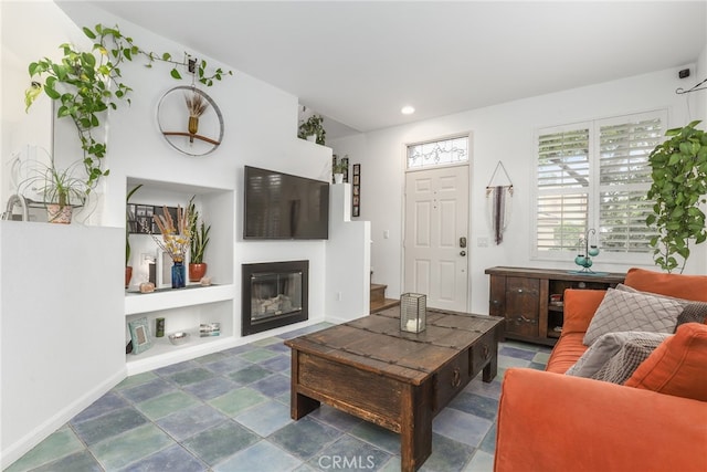 living room featuring built in shelves