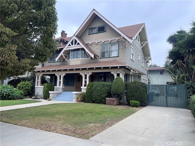 view of front facade with a porch and a front lawn