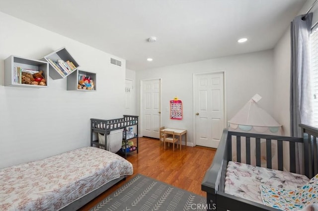 bedroom featuring hardwood / wood-style floors