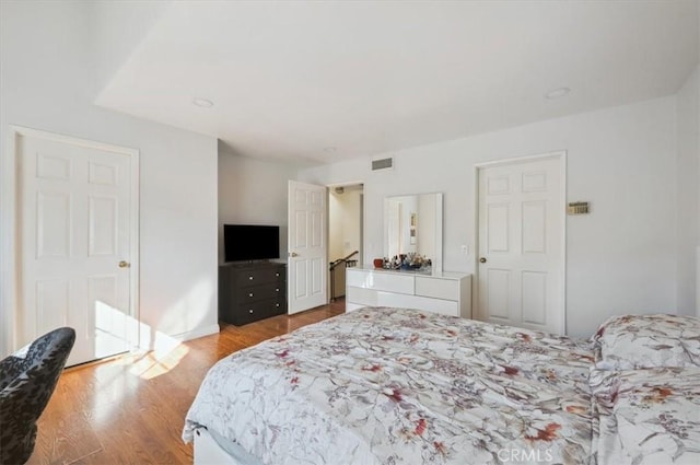 bedroom with light hardwood / wood-style floors