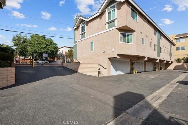 view of side of property with a garage