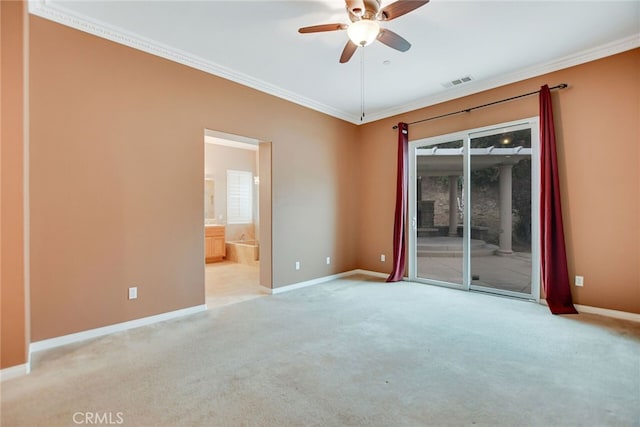 carpeted spare room with ornamental molding and ceiling fan